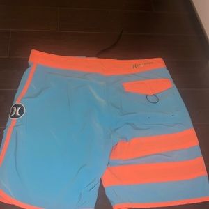 Hurley men swim trunks (orange and blue neon)